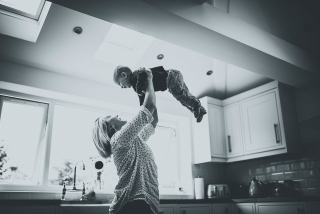 Mum lifting son up at a Cheshire Lifestyle Family Photography Session