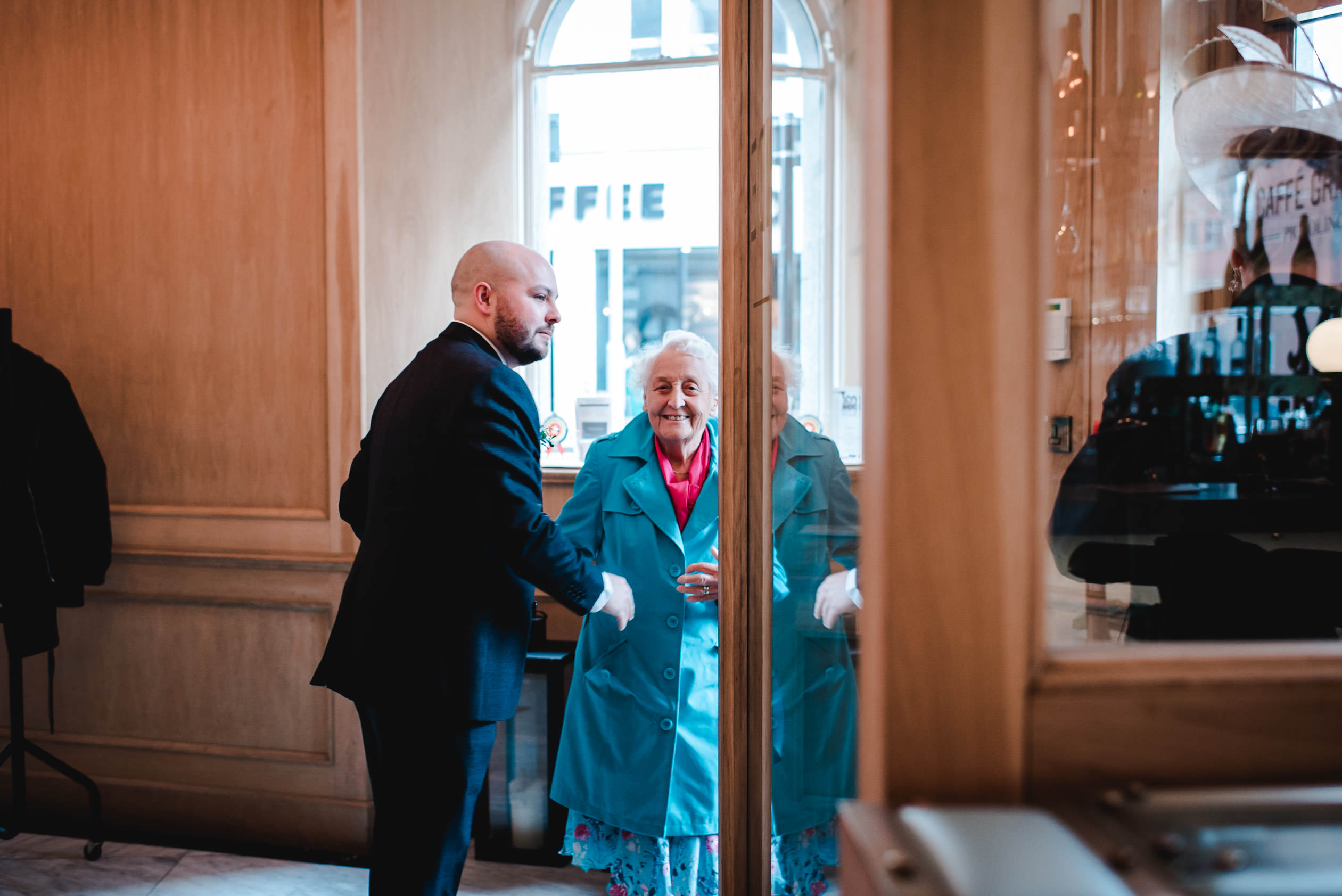Elderley Lady and groom at caffe grande in manchester