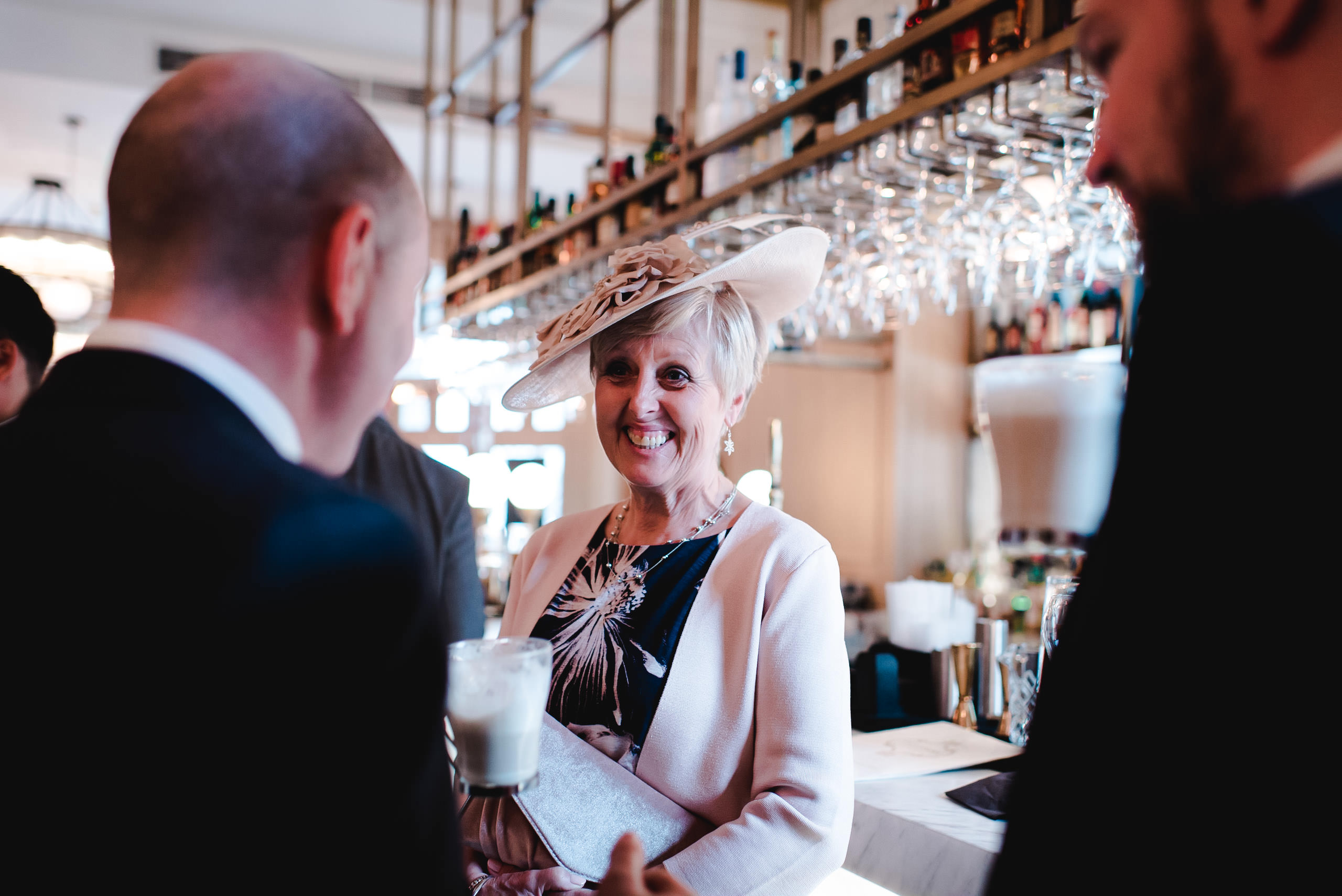 Mother of groom smiling at caffe grande in manchester