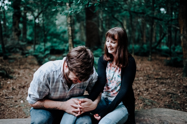Greg & Holly laughing in the woods at their Cheshire Engagement Session