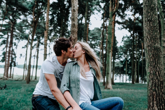 Lauren and Christopher kissing on their vintage bikes at Cheshire Engagement Session