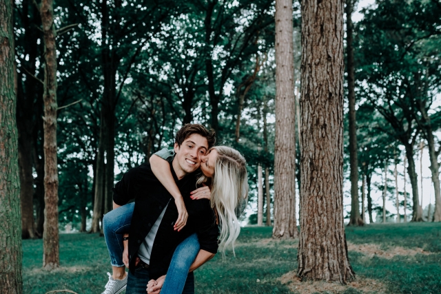 Christopher giving Lauren a piggy back at Cheshire Engagement Session